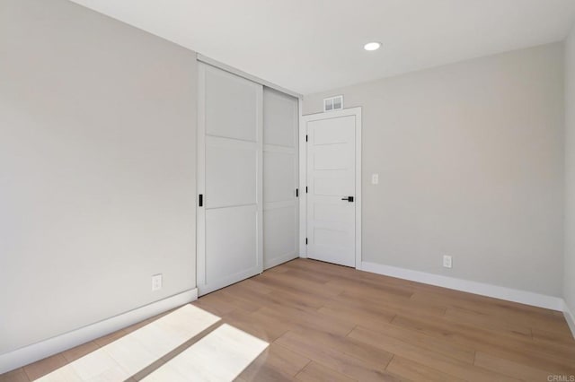 1358 Walnutview Dr, Encinitas, CA 92024 - unfurnished bedroom with light wood-style floors, recessed lighting, and a closet