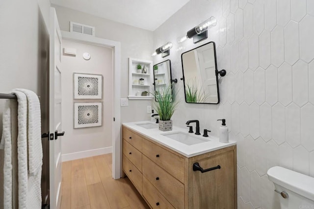 1358 Walnutview Dr, Encinitas, CA 92024 - full bathroom with double vanity and wood finished floors