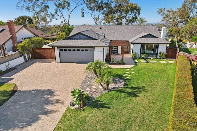 1358 Walnutview Dr, Encinitas, CA 92024 - single story home with an attached garage, decorative driveway, a shingled roof, and a chimney