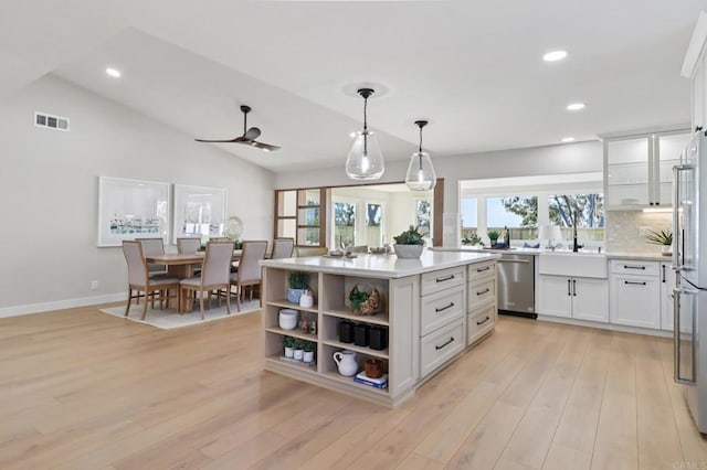 1358 Walnutview Dr, Encinitas, CA 92024 - kitchen featuring stainless steel appliances, white cabinetry, light countertops, healthy amount of natural light, and recessed lighting