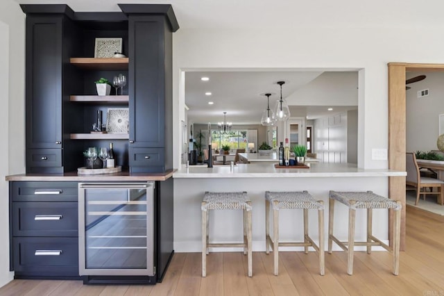 1358 Walnutview Dr, Encinitas, CA 92024 - bar with beverage cooler, light wood finished floors, a chandelier, and recessed lighting