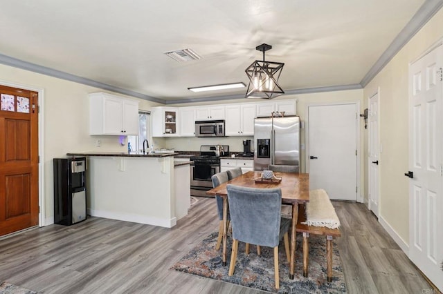 8980 Lamar St # 6, Spring Valley, CA 91977 - dining room with crown molding and wood finished floors