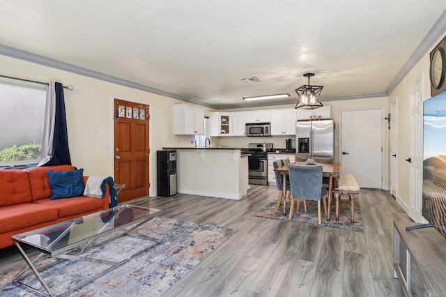 8980 Lamar St # 6, Spring Valley, CA 91977 - living room featuring wood finished floors and ornamental molding