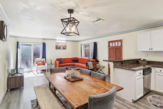 8980 Lamar St # 6, Spring Valley, CA 91977 - dining area with crown molding and light wood-style floors