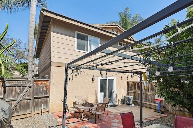 8980 Lamar St # 6, Spring Valley, CA 91977 - back of property with a pergola, a fire pit, stucco siding, and a patio area