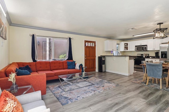 8980 Lamar St # 6, Spring Valley, CA 91977 - living area featuring wood finished floors and ornamental molding