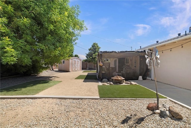 341 Mellane Cir, Orland, CA 95963 - view of green lawn with a storage unit and a patio