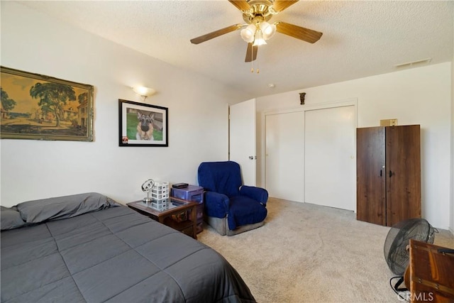 341 Mellane Cir, Orland, CA 95963 - carpeted bedroom featuring a closet, a textured ceiling, and a ceiling fan
