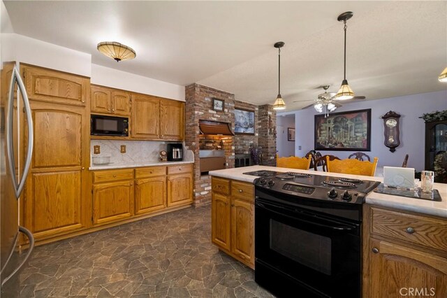 341 Mellane Cir, Orland, CA 95963 - kitchen with black appliances, light countertops, brown cabinets, and dark stone finish floors