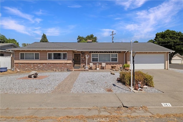 341 Mellane Cir, Orland, CA 95963 - single story home with concrete driveway, a garage, brick siding, and a chimney
