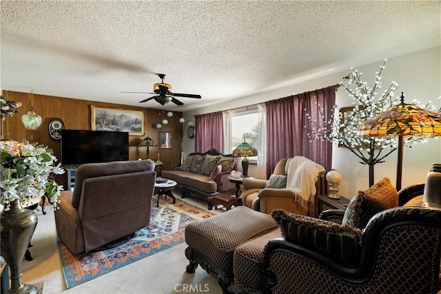 341 Mellane Cir, Orland, CA 95963 - carpeted living room with a ceiling fan, a textured ceiling, and wooden walls