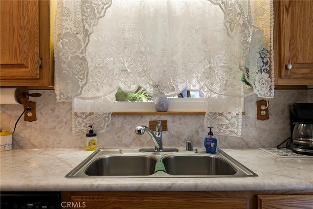 341 Mellane Cir, Orland, CA 95963 - kitchen with brown cabinetry, light countertops, and decorative backsplash