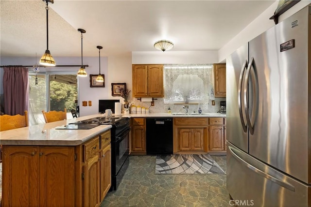 341 Mellane Cir, Orland, CA 95963 - kitchen featuring black appliances, a peninsula, light countertops, brown cabinets, and tasteful backsplash