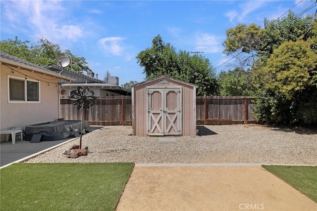 341 Mellane Cir, Orland, CA 95963 - fenced backyard featuring a storage unit and a patio area
