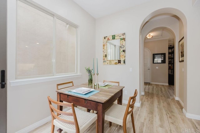 2740 E Bainbridge Rd, San Diego, CA 92106 - dining area with arched walkways and light wood-style flooring