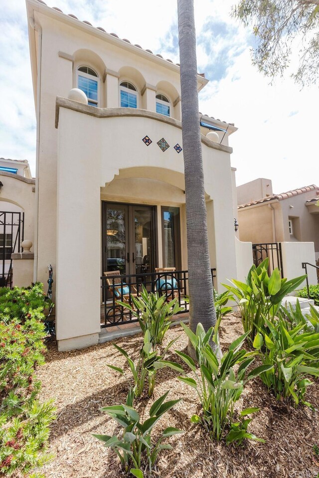 2740 E Bainbridge Rd, San Diego, CA 92106 - rear view of property with french doors and stucco siding