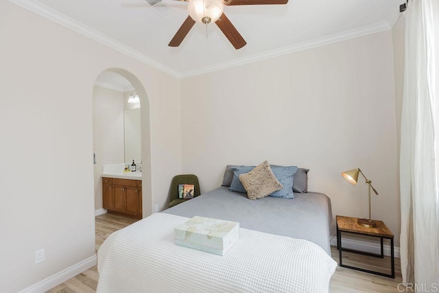 2740 E Bainbridge Rd, San Diego, CA 92106 - bedroom with light wood finished floors, crown molding, arched walkways, ensuite bathroom, and a ceiling fan