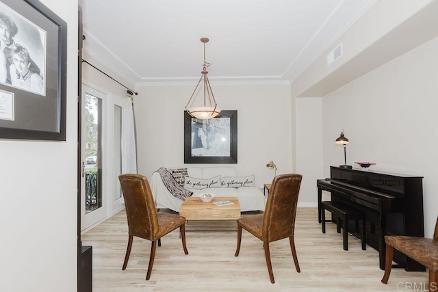 2740 E Bainbridge Rd, San Diego, CA 92106 - dining space with light wood-type flooring and crown molding
