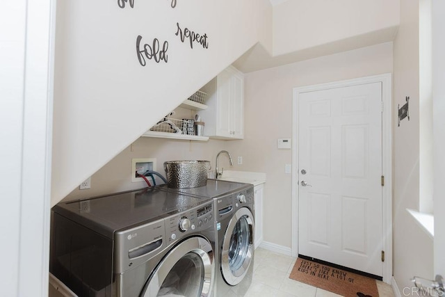 2740 E Bainbridge Rd, San Diego, CA 92106 - washroom featuring washer and dryer, cabinet space, and light tile patterned floors