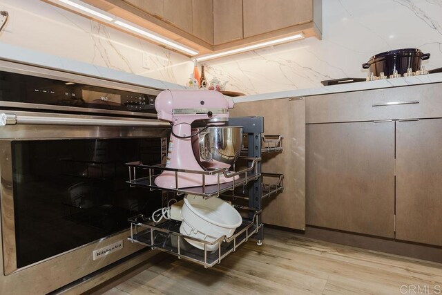 2740 E Bainbridge Rd, San Diego, CA 92106 - kitchen view of stainless steel oven and light wood-style flooring