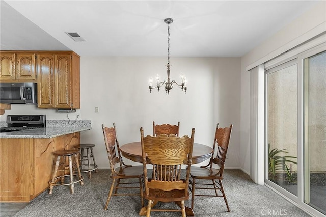 834 E Pepper Tree Dr, Azusa, CA 91702 - dining space featuring a chandelier and light colored carpet