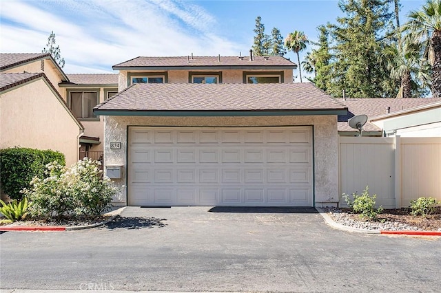 834 E Pepper Tree Dr, Azusa, CA 91702 - view of front of property featuring stucco siding, an attached garage, and driveway