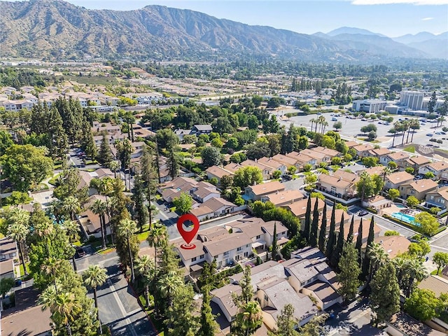 834 E Pepper Tree Dr, Azusa, CA 91702 - aerial overview of property's location with a mountain backdrop and nearby suburban area