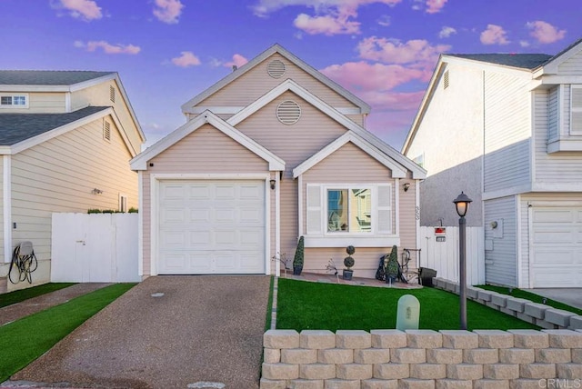 353 61st St, San Diego, CA 92114 - view of front facade with asphalt driveway and an attached garage