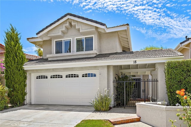 18 Saint Thomas, Laguna Niguel, CA 92677 - traditional-style home featuring a tile roof, a garage, stucco siding, and driveway
