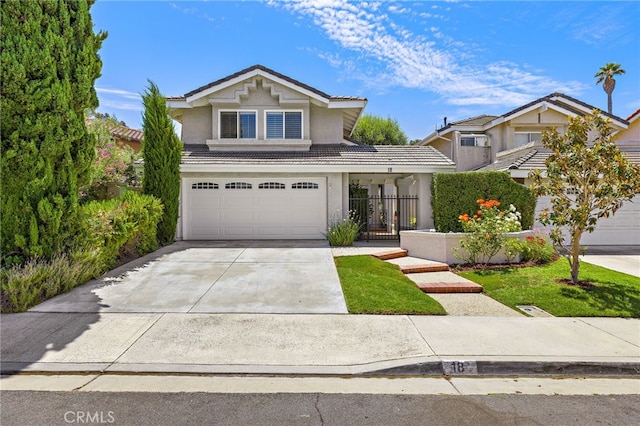 18 Saint Thomas, Laguna Niguel, CA 92677 - traditional-style house with a tile roof, stucco siding, concrete driveway, and a garage