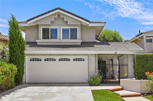 18 Saint Thomas, Laguna Niguel, CA 92677 - traditional-style house with a tile roof, a garage, stucco siding, and concrete driveway