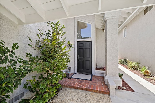 18 Saint Thomas, Laguna Niguel, CA 92677 - doorway to property featuring stucco siding