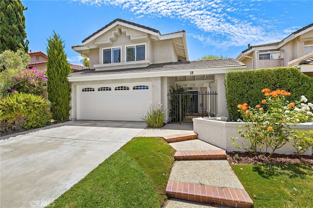 18 Saint Thomas, Laguna Niguel, CA 92677 - view of front of property with a tile roof, stucco siding, an attached garage, and driveway