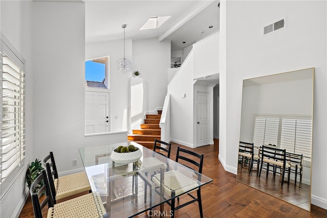 18 Saint Thomas, Laguna Niguel, CA 92677 - dining space featuring healthy amount of natural light, high vaulted ceiling, stairs, wood finished floors, and a skylight