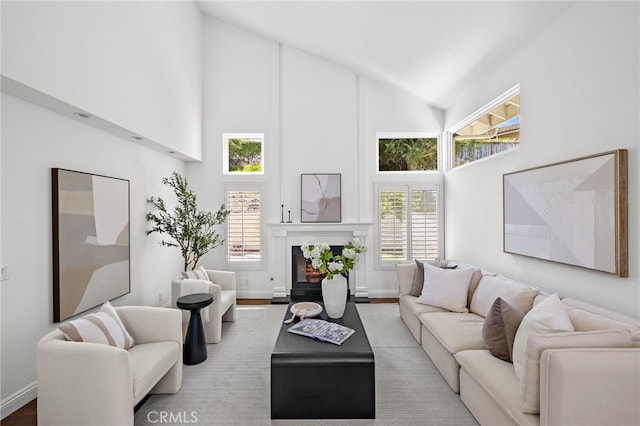 18 Saint Thomas, Laguna Niguel, CA 92677 - living area with high vaulted ceiling, wood finished floors, and a warm lit fireplace