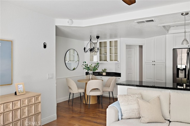 18 Saint Thomas, Laguna Niguel, CA 92677 - dining space featuring dark wood-style flooring and a chandelier