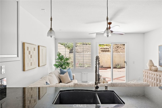 18 Saint Thomas, Laguna Niguel, CA 92677 - kitchen featuring ceiling fan, decorative light fixtures, open floor plan, and stone counters