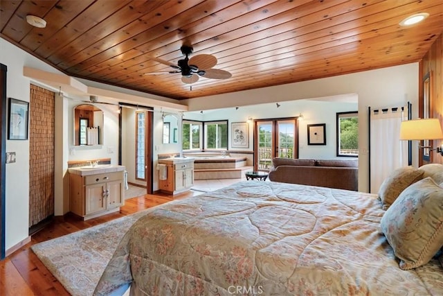 2310 Oak Haven Ln, Arroyo Grande, CA 93420 - bedroom with wood ceiling, light wood-style floors, and arched walkways
