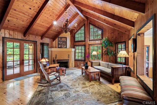 2310 Oak Haven Ln, Arroyo Grande, CA 93420 - living room featuring hardwood / wood-style flooring, a wood ceiling with exposed beams, wooden walls, a chandelier, and french doors
