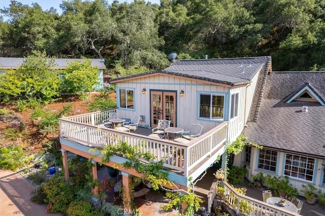 2310 Oak Haven Ln, Arroyo Grande, CA 93420 - rear view of house featuring french doors, board and batten siding, a deck, and roof with shingles