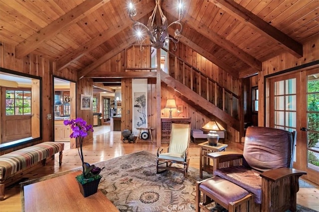 2310 Oak Haven Ln, Arroyo Grande, CA 93420 - living area featuring wooden walls, light wood-style flooring, a chandelier, healthy amount of natural light, and a wooden ceiling with exposed beams