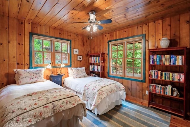 2310 Oak Haven Ln, Arroyo Grande, CA 93420 - bedroom featuring multiple windows, wood finished floors, wooden walls, and wooden ceiling