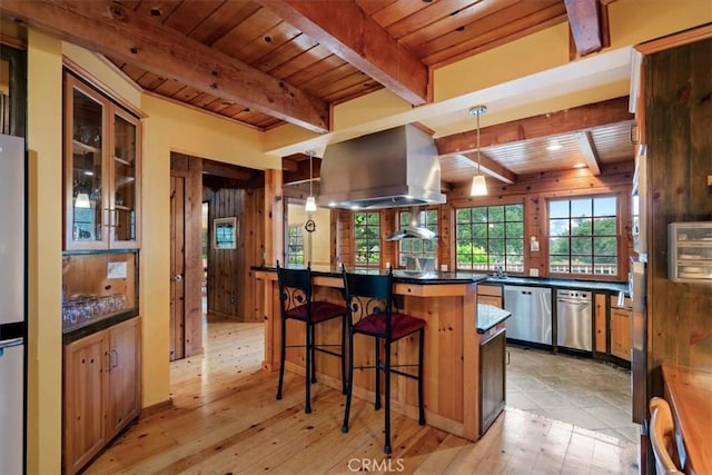 2310 Oak Haven Ln, Arroyo Grande, CA 93420 - kitchen with stainless steel appliances, a wood ceiling with exposed beams, dark countertops, a kitchen breakfast bar, and island exhaust hood