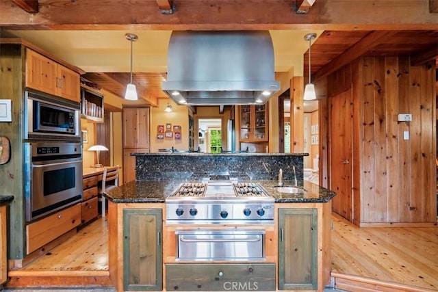 2310 Oak Haven Ln, Arroyo Grande, CA 93420 - kitchen with appliances with stainless steel finishes, a warming drawer, island range hood, light wood-style floors, and dark stone countertops