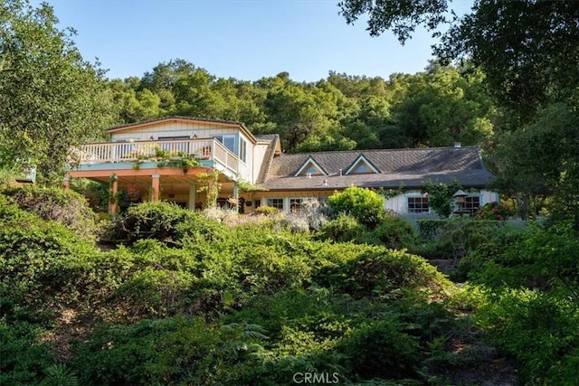 2310 Oak Haven Ln, Arroyo Grande, CA 93420 - rear view of house with a forest view and a wooden deck