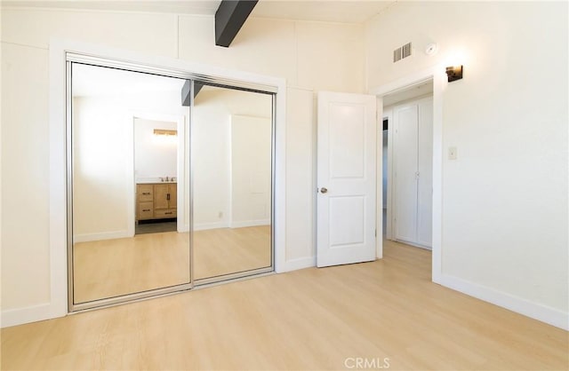 13870 Larwin Rd, La Mirada, CA 90638 - unfurnished bedroom featuring light wood-type flooring, a closet, and lofted ceiling