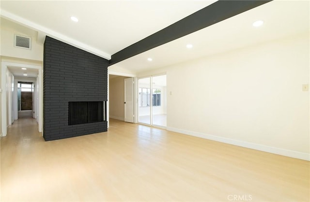 13870 Larwin Rd, La Mirada, CA 90638 - unfurnished living room featuring light wood-style floors, a brick fireplace, and recessed lighting