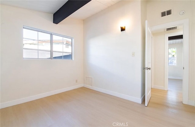 13870 Larwin Rd, La Mirada, CA 90638 - empty room featuring light wood-style flooring, beam ceiling, and a smoke detector