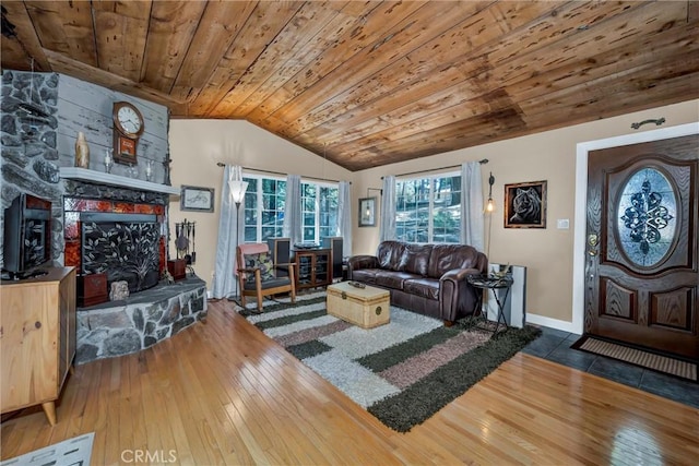 16635 Mountain View Dr, Cobb, CA 95426 - living area with wood ceiling, lofted ceiling, hardwood / wood-style floors, and a stone fireplace