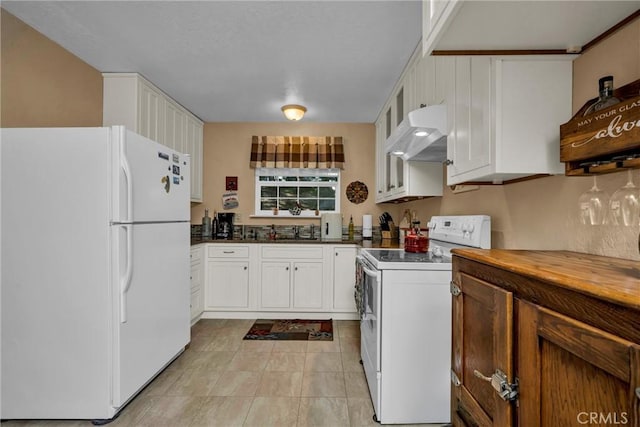 16635 Mountain View Dr, Cobb, CA 95426 - kitchen with white appliances, under cabinet range hood, white cabinets, and glass insert cabinets